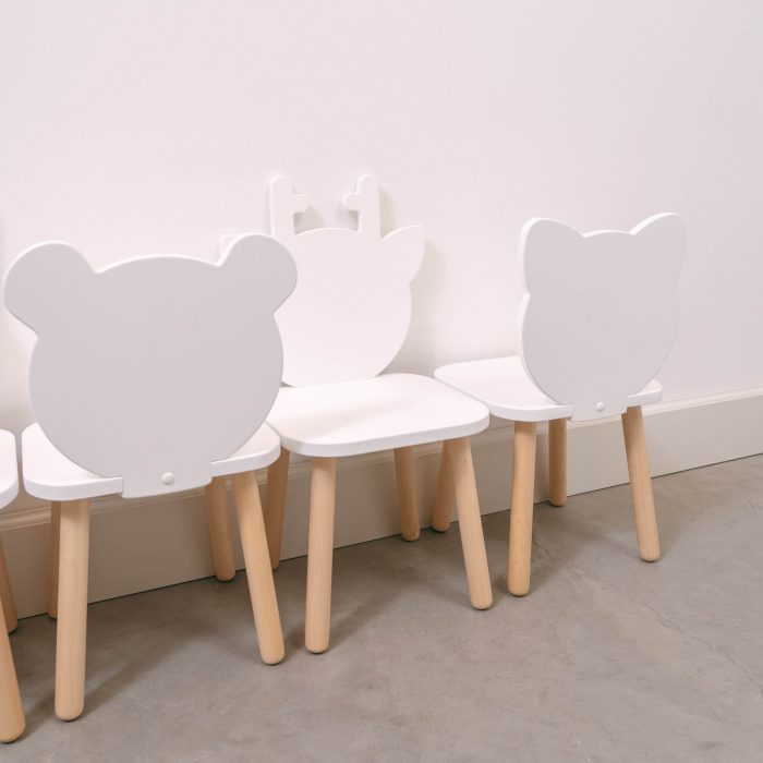 White table and chair set with wooden legs