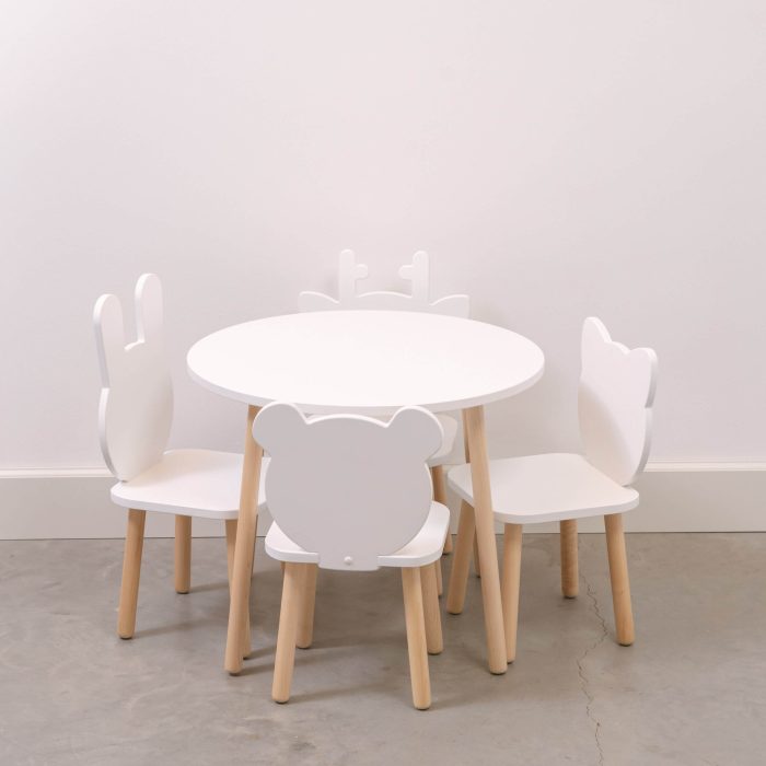 White table and chair set with wooden legs